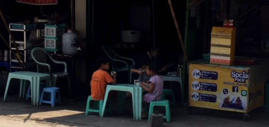 Children drinking tea in Yangon Myanmar (Burma) Feb 2017
